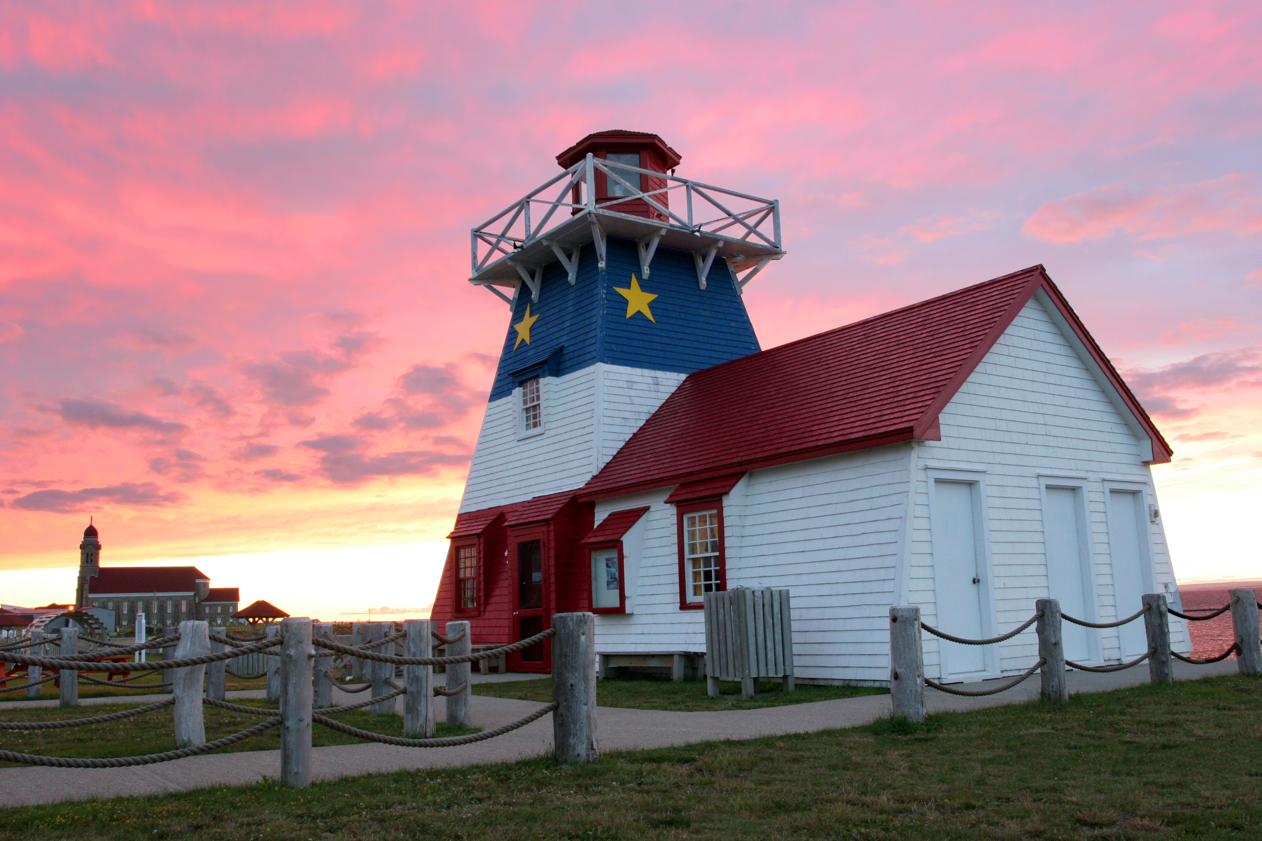 Grande-Anse Lighthouse and Cathedral at sunset - New Brunswick - Canada