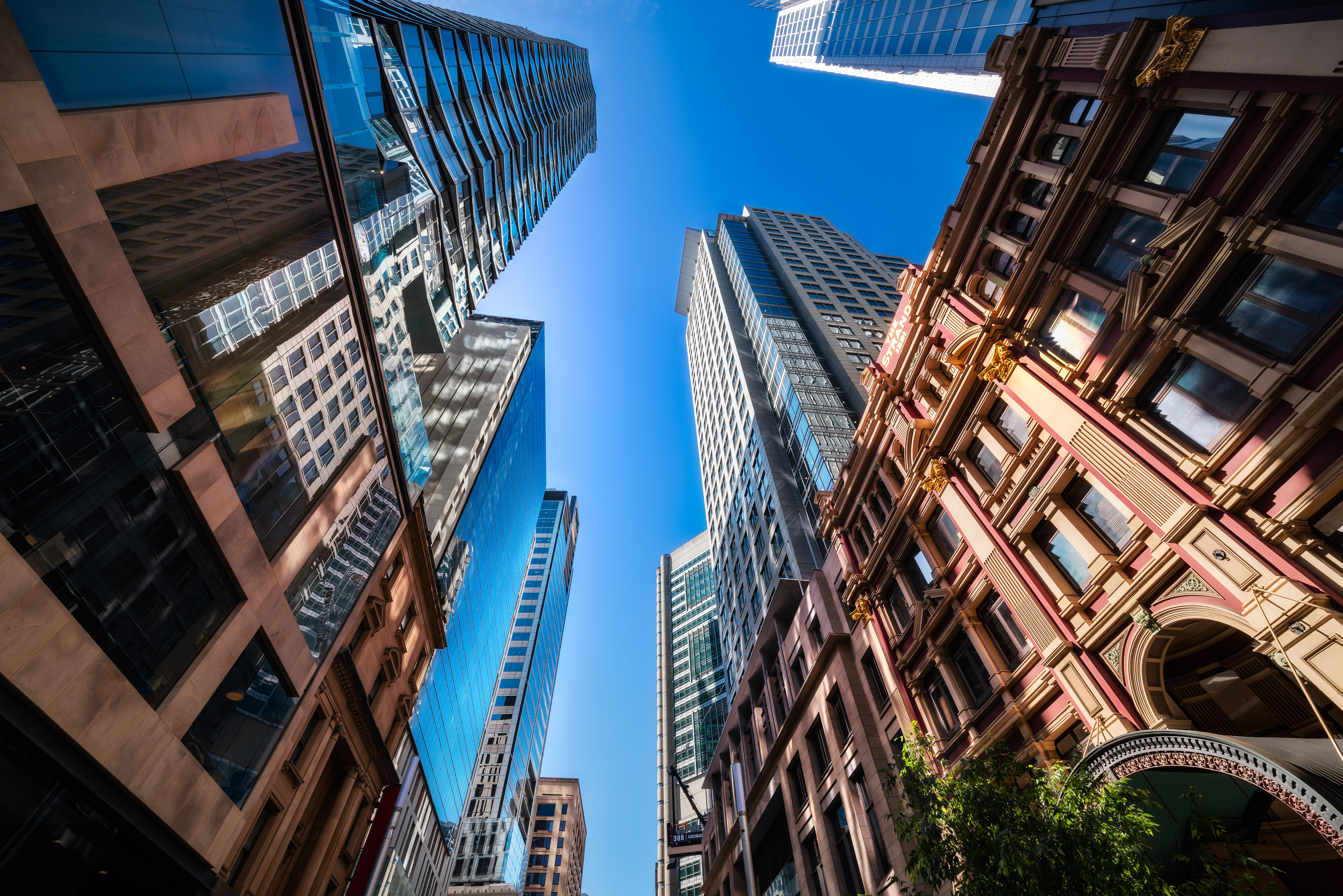 Sydney, NSW, Australia - October 21, 2019: Looking up perspective from George street at major landmarks and City Towers in Sydney CBD, Australia.